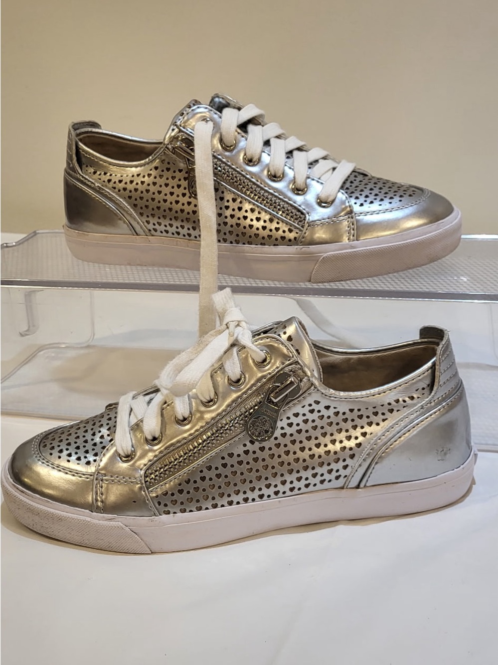 GUESS metallic silver perforated heart sneakers